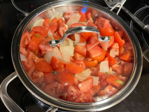 Tomatoes, onions, and jalapeños stewing